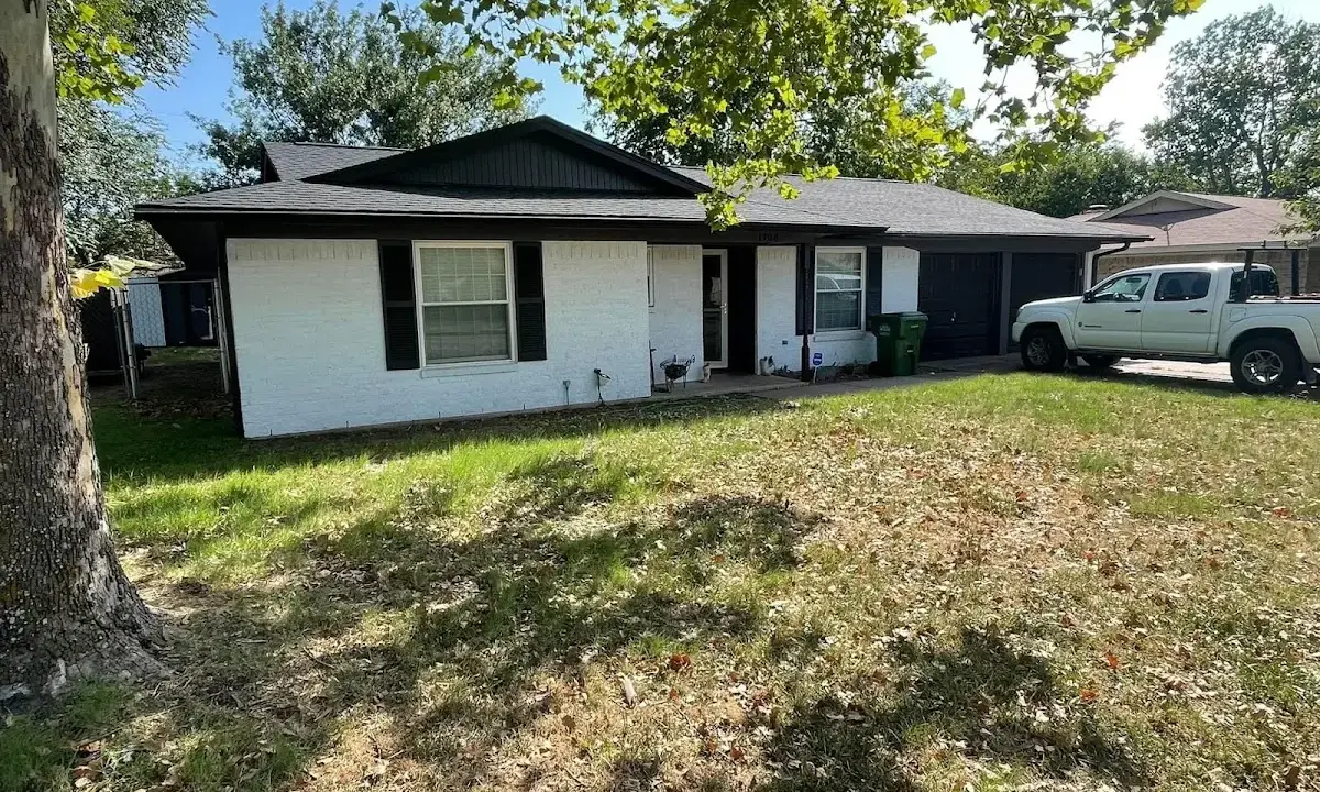 Professional roofing crew working on a residential roof in Lynchburg